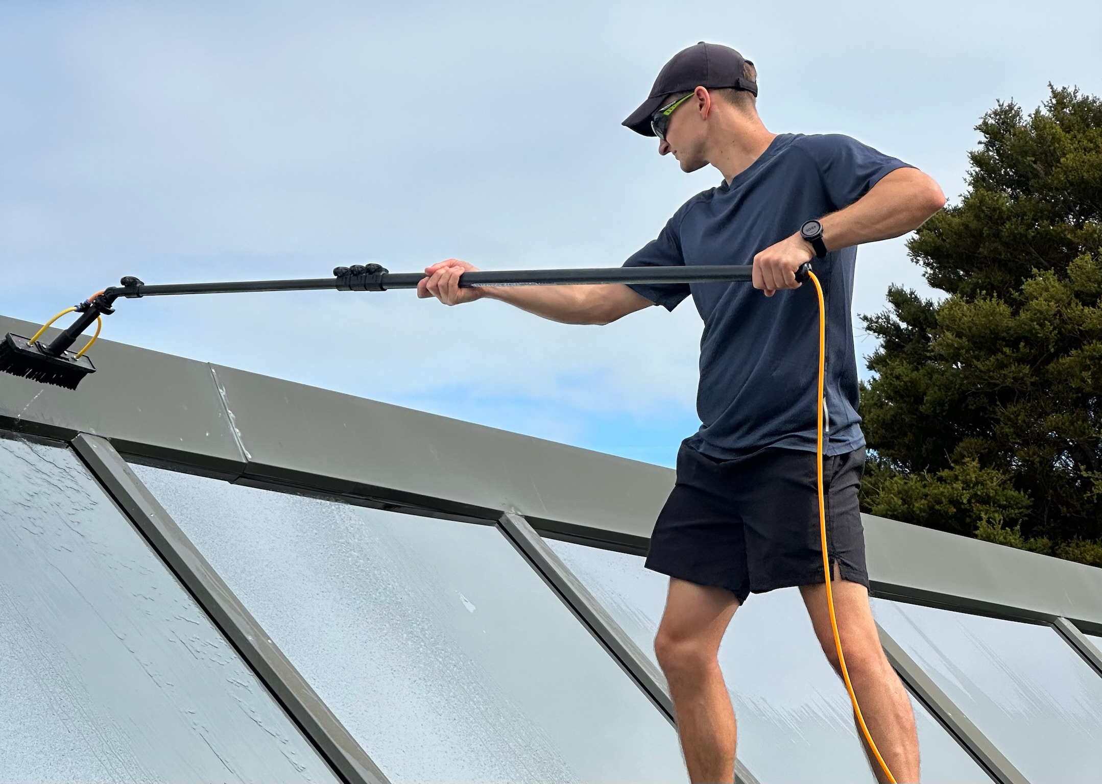 Exterior window cleaning on a coastal home