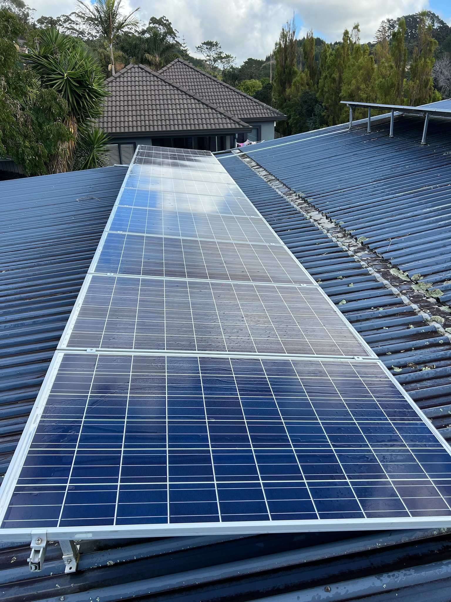 Solar panels after professional cleaning on a residential roof